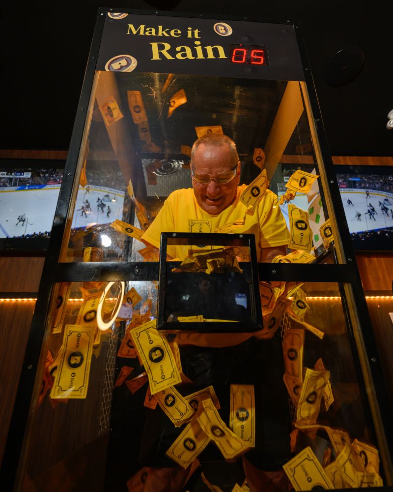A guest playing in Betty’s Make it Rain machine.