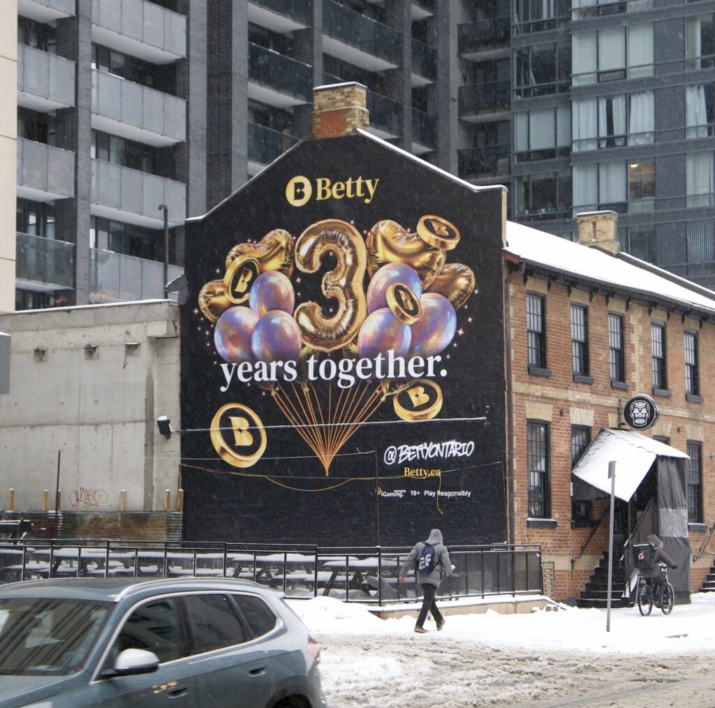 A photograph of Betty’s Big 3 mural, located at John St & Lane North King West John.