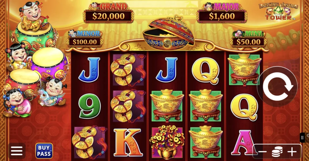 Dancing Drums Tower slot screen: red and gold reels with Fu Babies, gold ingots and coin symbols under a four-tier jackpot panel.